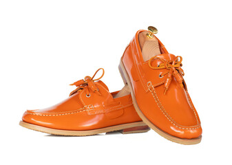 Men fashion orange leather boat shoes with shoe tree (shape supporter)  isolated on white background. clipping path