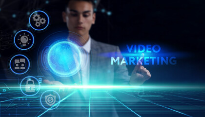 Business, technology, internet and network concept. Young businessman thinks over the steps for successful growth: Video marketing