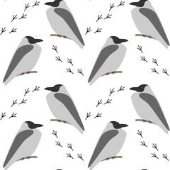 Naklejka premium Seamless pattern with grey crows and birds tracks on the snow. Winter design