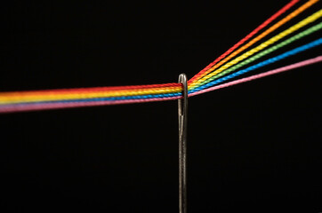 color spectrum thread and needle