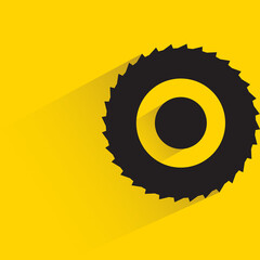 cog blade with drop shadow on yellow background