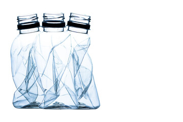 Crushed bottles isolated on white background