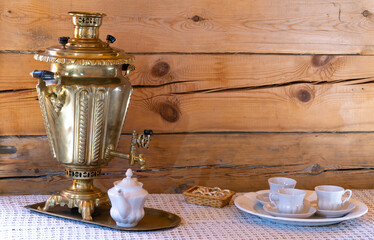 Russian samovar on the table. set table for tea.