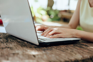 High school or college student learning tutoring on desk and reading, doing homework, lesson practice preparing exam on laptop at home.