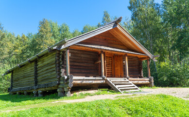 old wooden building in the forest. Russian barn. ancient, wooden architecture.