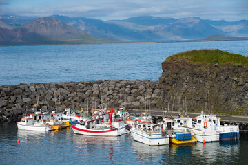 Fototapeta na wymiar Summertime, Beautiful view of Fishing ships in Arnarstapi harbor at Snaefellsnes peninsula in Iceland