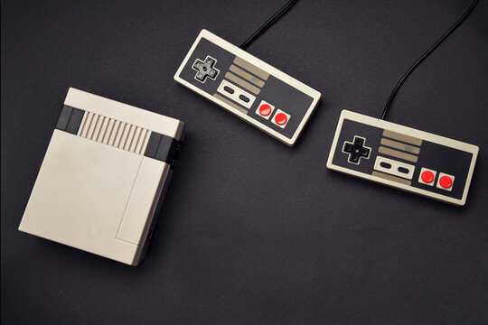 retro console and controls on black background