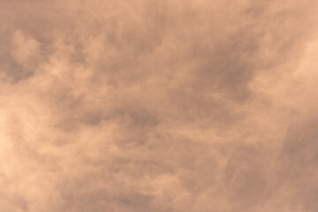 Orange-gold moving clouds abstract background image.