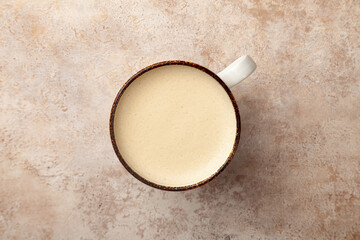 Latte coffee cup with milk froth on vintage background