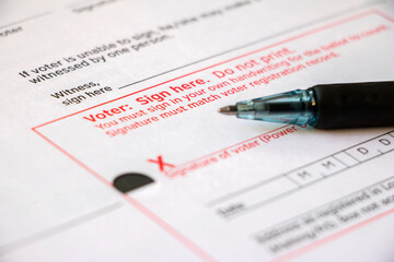 Closeup voter signature line and pen