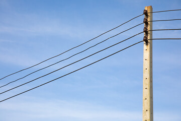 Close up shot with copy space of electricity pole and power cable lines installed in rural area...