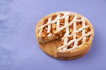 Homemade apple pie charlotte and piece of cake on plate