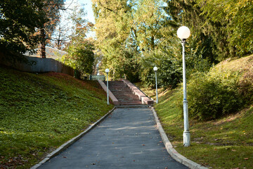 Park path ending with a stone staircase.