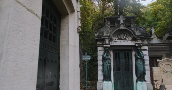 beautiful family vault in  in pere lachaise cemetary on a rainy day
