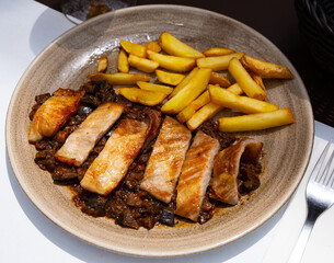 Spanish secreto iberico - iberian pork in sweet wine with stewed vegetables. High quality photo
