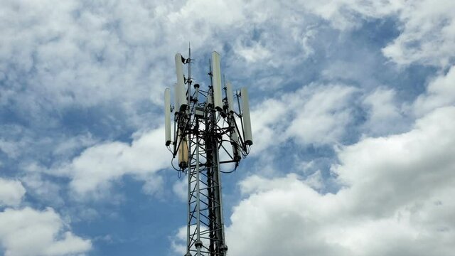 5G Telecommunications tower with cellular transmitters and antennas in asian city
