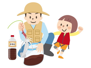釣ったイカを沖漬けにする男性と喜ぶ女の子