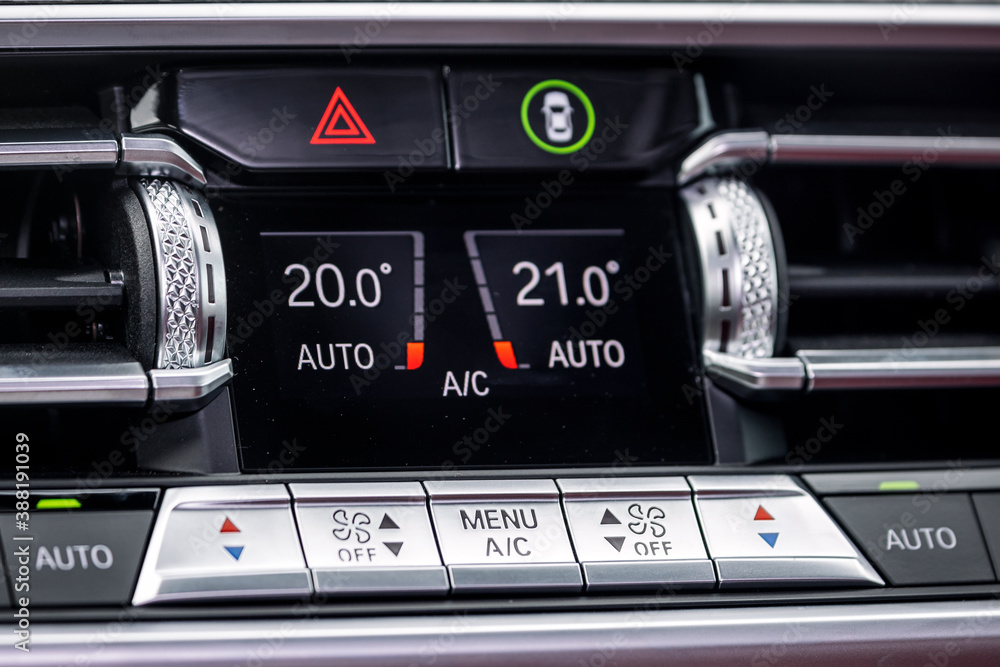 Poster close up of separate climate control in an expensive car. conditioner and air flow control in a mode
