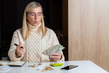 emotional freelance woman calculating budget in home office, work from home concept