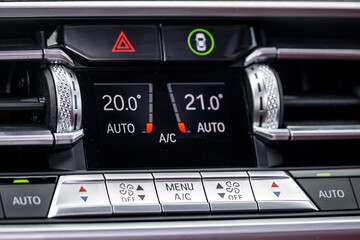 close up of  separate climate control in an expensive car. Conditioner and air flow control in a modern car