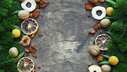 Happy New Happy full harvest year 2021. Branches of a Christmas tree are laid out on a wooden background. Christmas background.