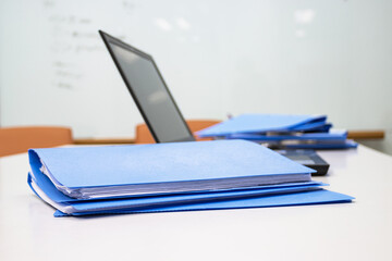 Blue Document folder with Notebook on table at office 