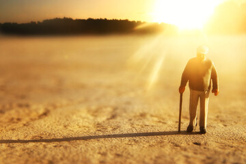 Fototapeta premium concept image of senior person walkin alone to his home
