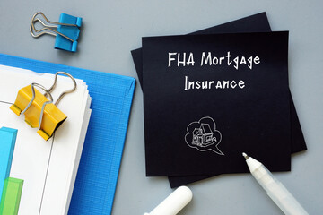 Financial concept about FHA Mortgage Insurance with inscription on the sheet.