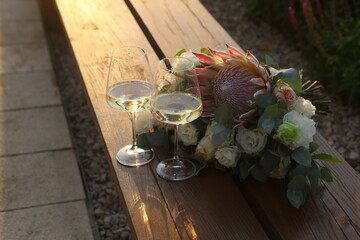 Wedding still life with champagne and a bouquet of flowers