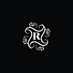 Initial Letter R Flourish circle monogram logo.