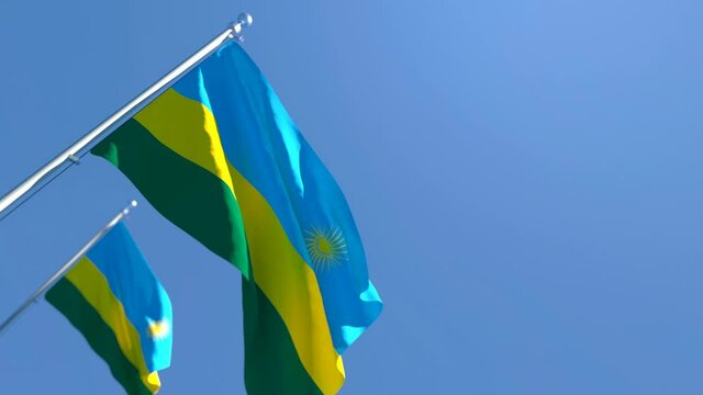 The national flag of Rwanda flutters in the wind