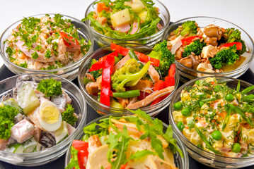 Healthy food - mix vegetable salad served in a bowl over white background. Healthy eating, delicious snack or sinner.