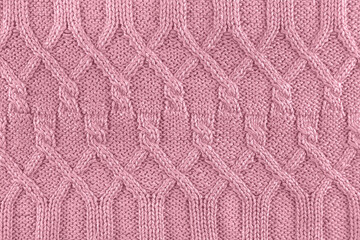 Fototapeta premium Knitted texture in pink color. Close up.
