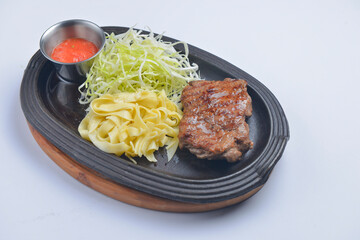 Juicy grilled barbecue steak served over white background. Delicious bbq meat concept
