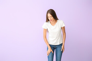 Woman with problem of limbs numbness on color background. Diabetes symptoms