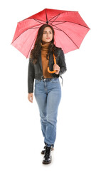 Stylish young woman with umbrella on white background