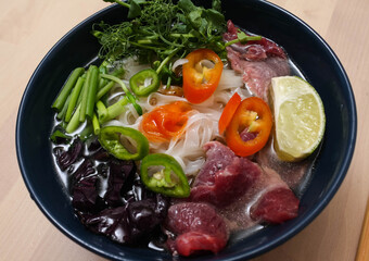 Vietnamese Fo-Bo soup with rice noodles and beef
