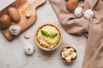 Fototapeta na wymiar Composition with tasty mashed potato and garlic on table