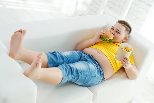 A boy with metabolic disorders. Child with the problem of childhood obesity. Overweight obese fat boy. High quality photo.