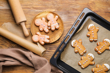 Composition with tasty gingerbread cookies on wooden background
