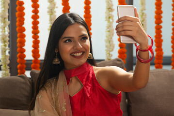 young beautiful girl happily looking in to the phone	