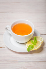 Ginger tea with mint, lemon and honey. Homemade warming tea for colds and flu.