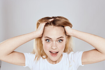 Fototapeta premium emotional blonde white t-shirt close-up studio lifestyle fun