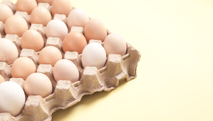 Eggs on yellow background. Food concept