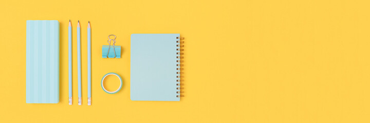 Banner with mint stationery on a bright yellow background. School concept with place for text.
