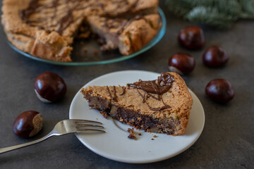 Delicious chestnut cake with almonds and chocolate glaze