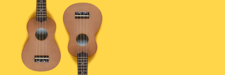 Creative banner with ukulele on a yellow background. Hawaiian guitars layout with place for text.
