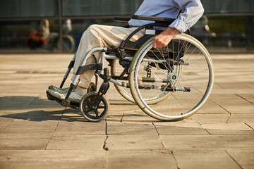 Elderly man in a wheelchair in the city
