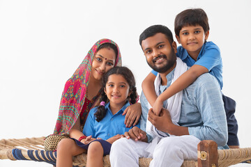 PORTRAIT OF A COMPLETE RURAL FAMILY HAPPILY LOOKING AT CAMERA
 - obrazy, fototapety, plakaty