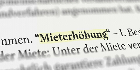 Das Wort Mieterhöhung im Buch mit Textmarker markiert